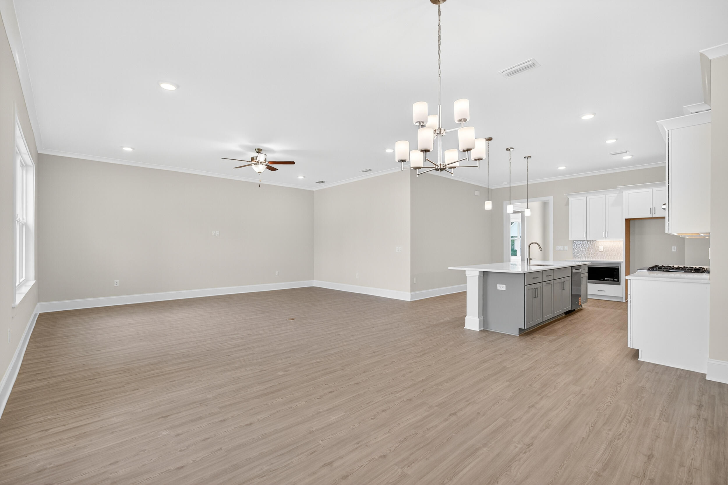 19 North J Hunter's Way, Unit LOT 22 Freeport, FL 32439 - Photo 11 of 48 a view of a kitchen with kitchen island and stainless steel appliances