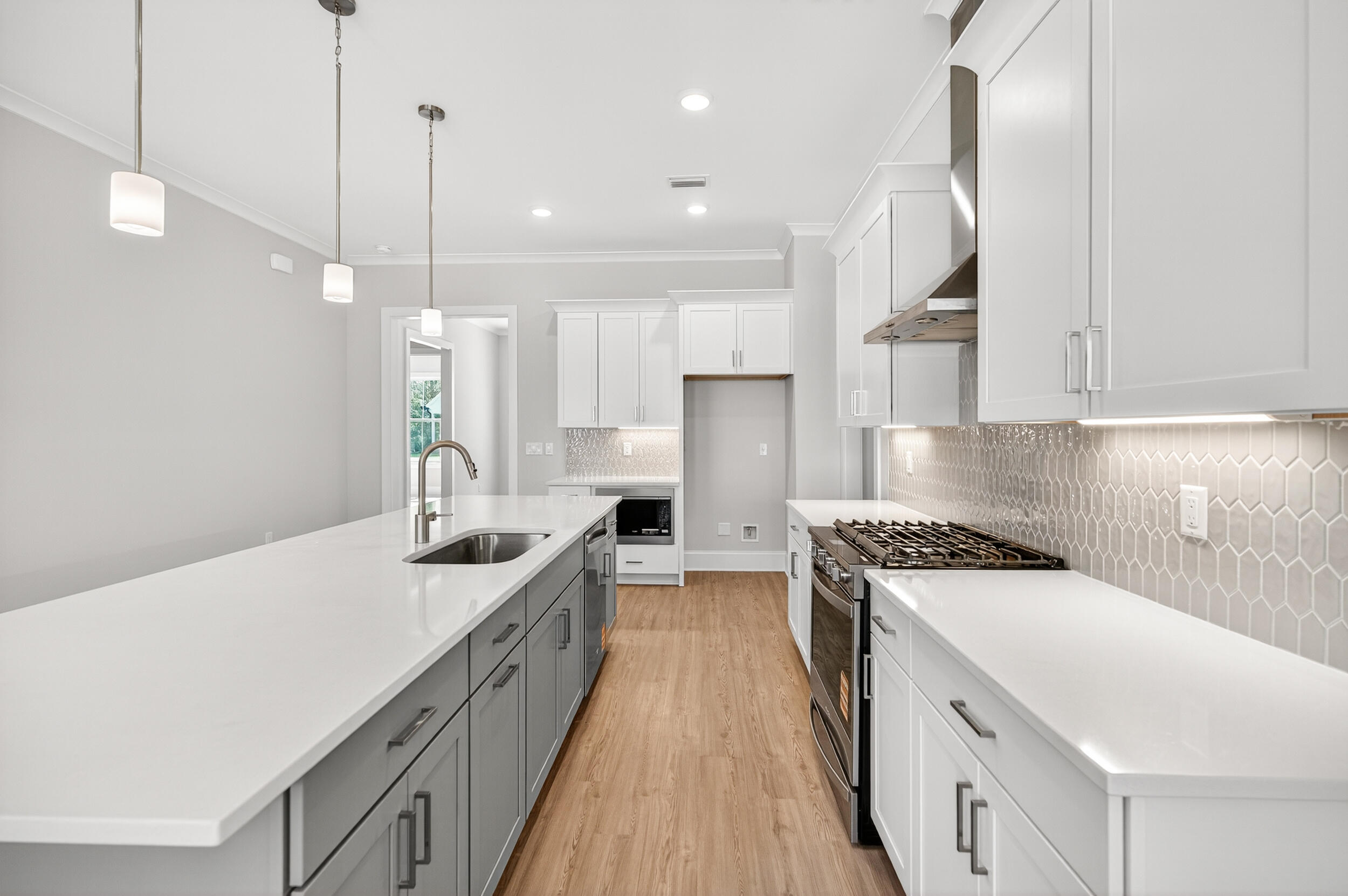 19 North J Hunter's Way, Unit LOT 22 Freeport, FL 32439 - Photo 15 of 48 a kitchen with stainless steel appliances granite countertop a sink a stove and a refrigerator
