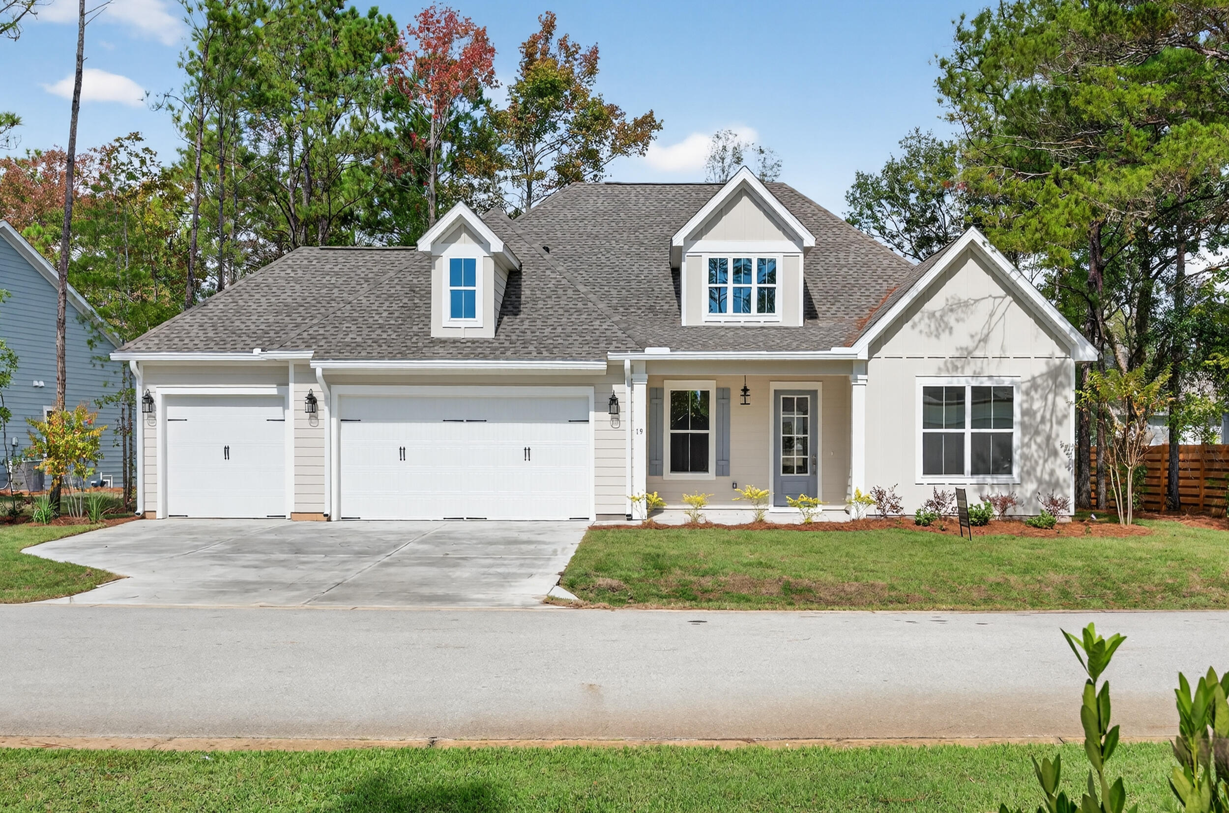 19 North J Hunter's Way, Unit LOT 22 Freeport, FL 32439 - Photo 2 of 48 a front view of a house with a yard and garage