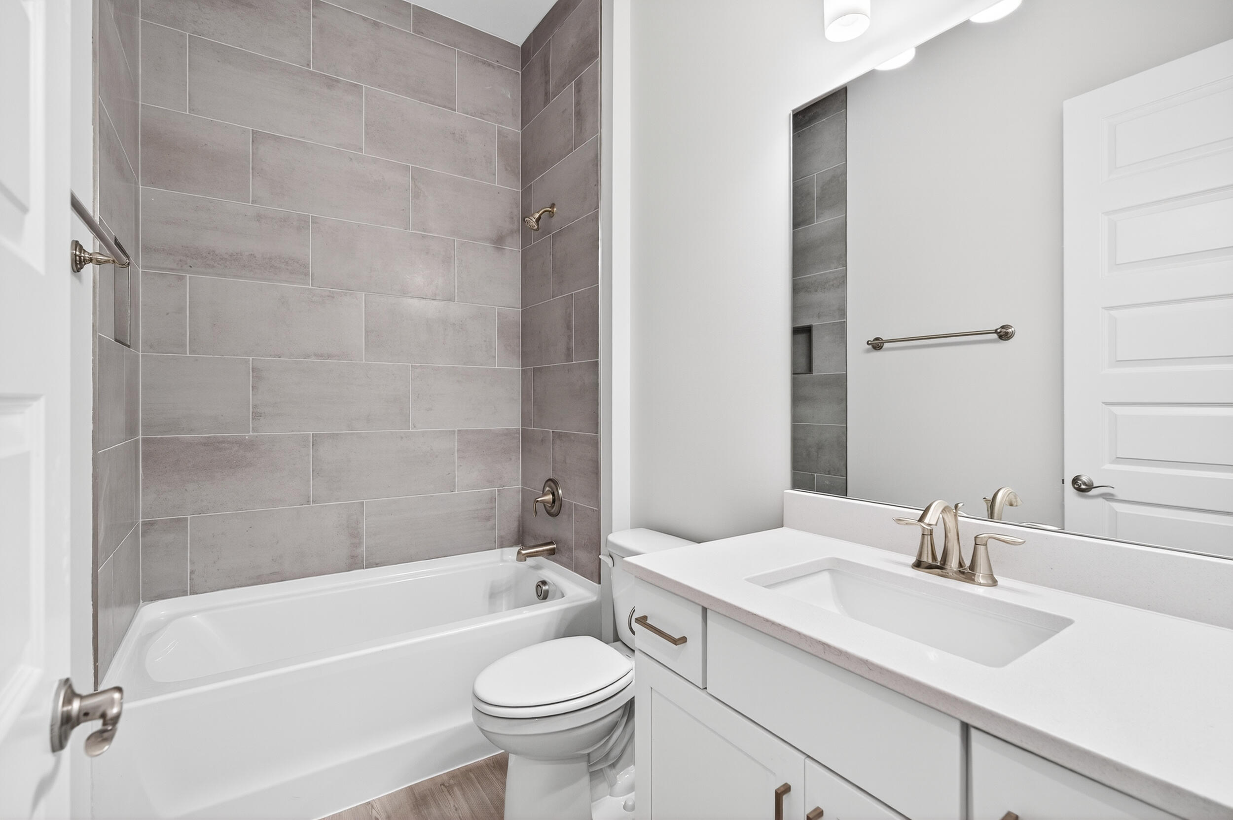 19 North J Hunter's Way, Unit LOT 22 Freeport, FL 32439 - Photo 30 of 48 a bathroom with a sink a toilet and bathtub