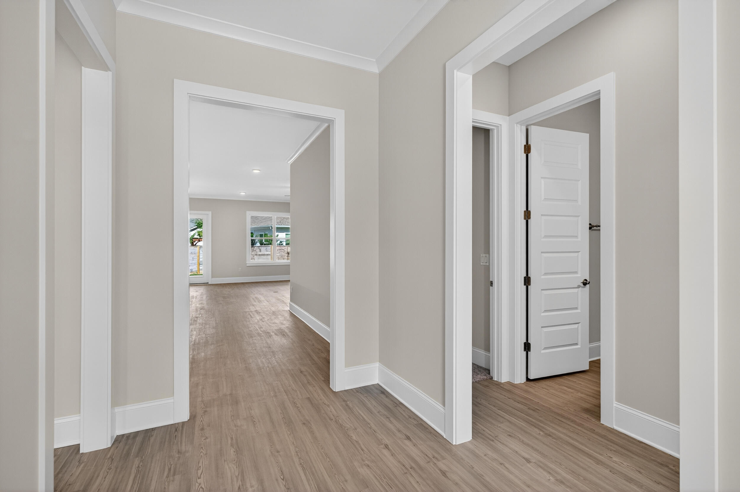 19 North J Hunter's Way, Unit LOT 22 Freeport, FL 32439 - Photo 4 of 48 a view of a hallway with wooden floor