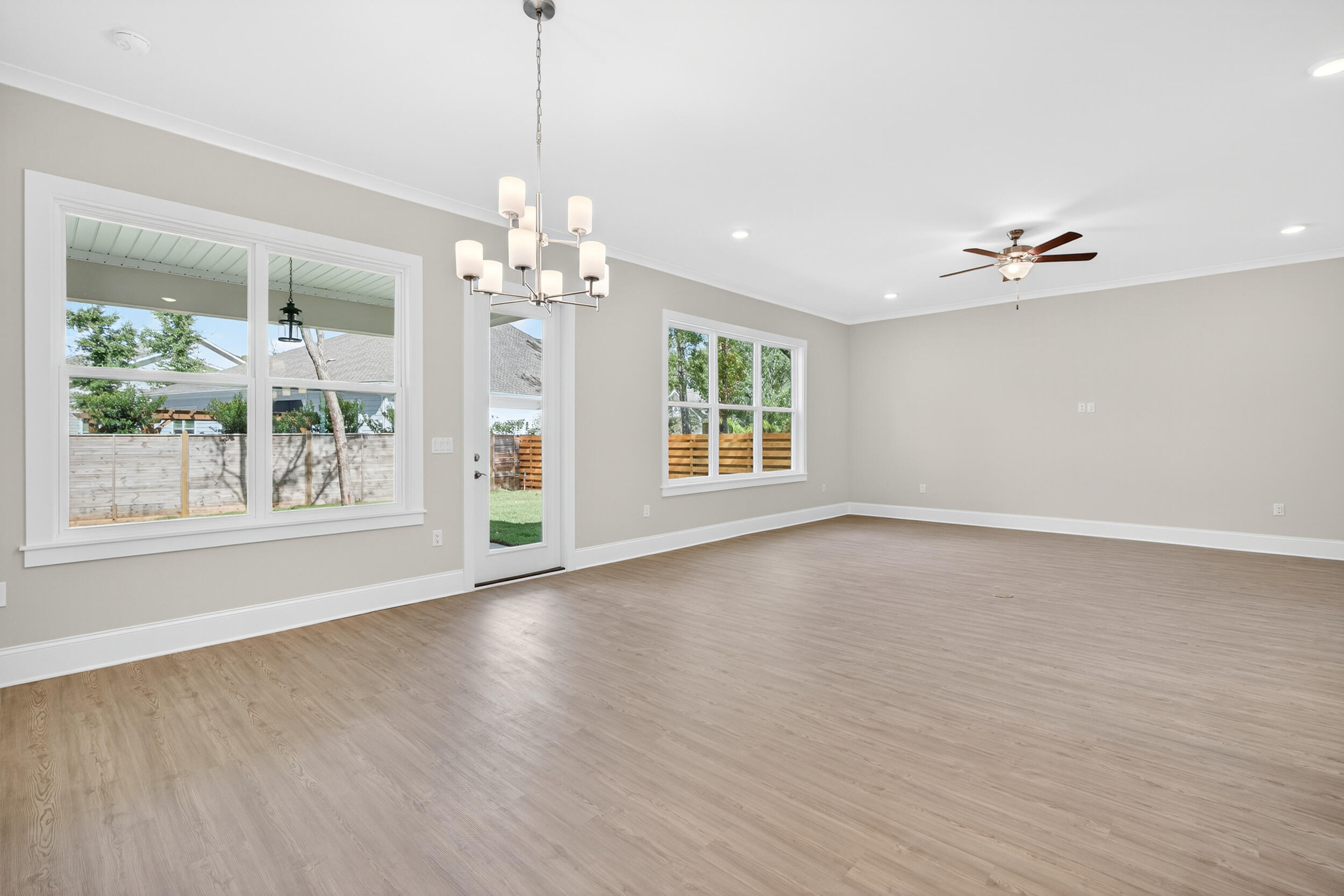 19 North J Hunter's Way, Unit LOT 22 Freeport, FL 32439 - Photo 10 of 48 a view of an empty room with a window and wooden floor