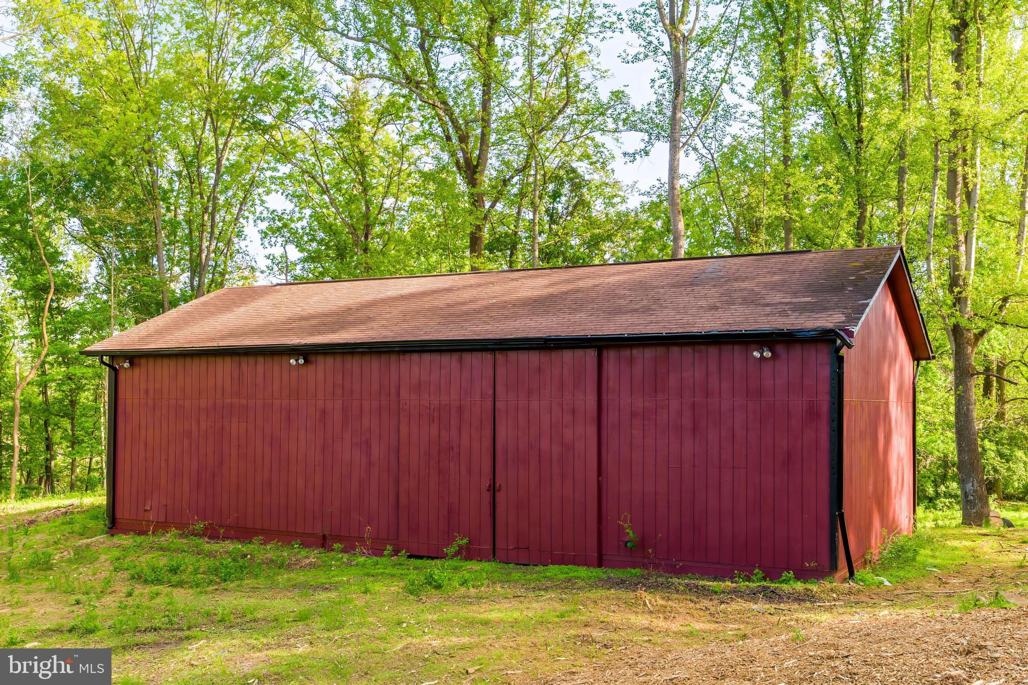 6891 Wilson Road Marshall, VA 20115 - Photo 115 of 118 Charming red barn nestled in greenery.