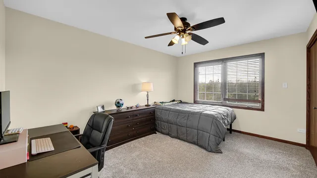 a living room with a bed furniture and a window