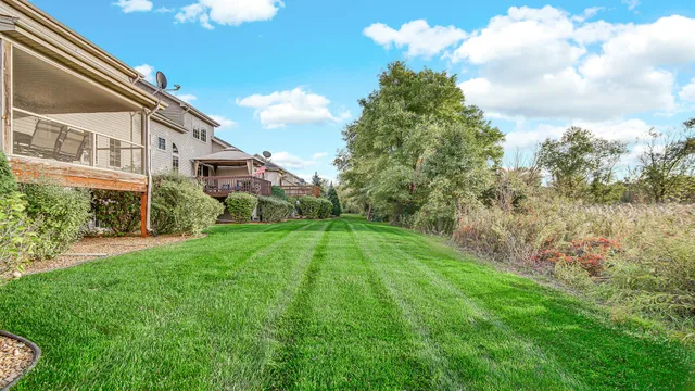 a view of a backyard of the house