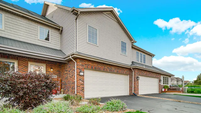 a view of a house with a garage