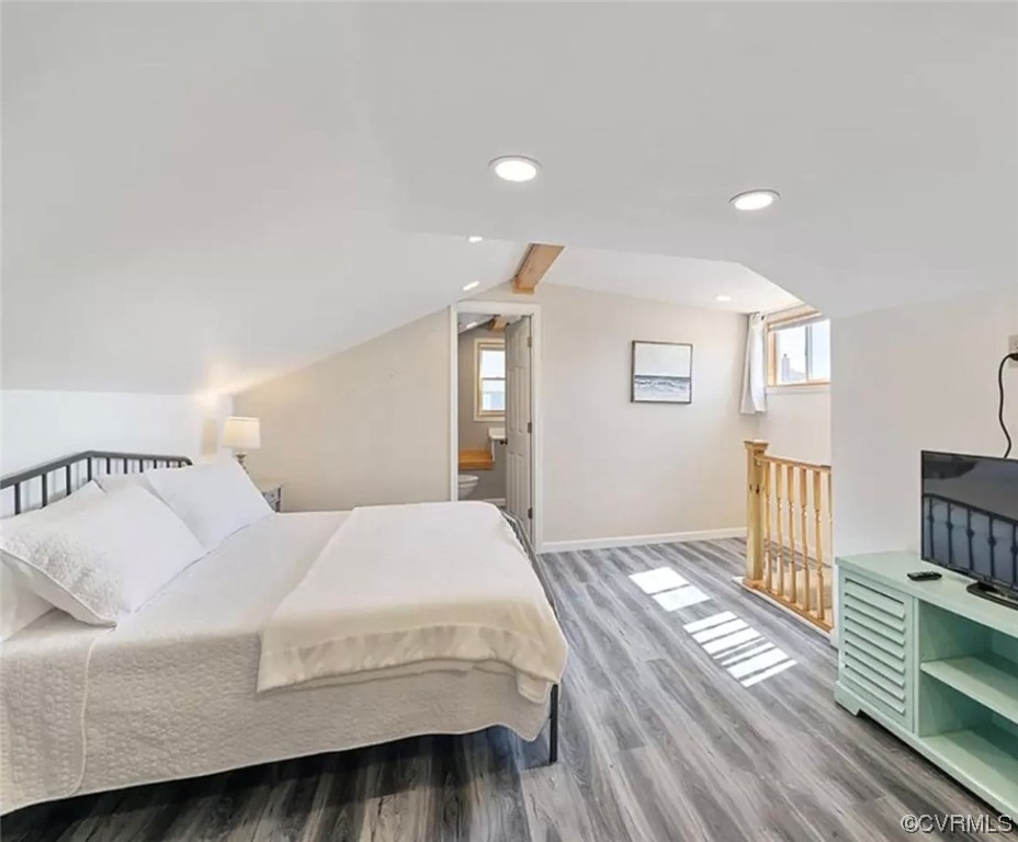 13 Lighthouse Drive Hampton, VA 23664 - Photo 13 of 28 a bedroom with a bed and wooden floor