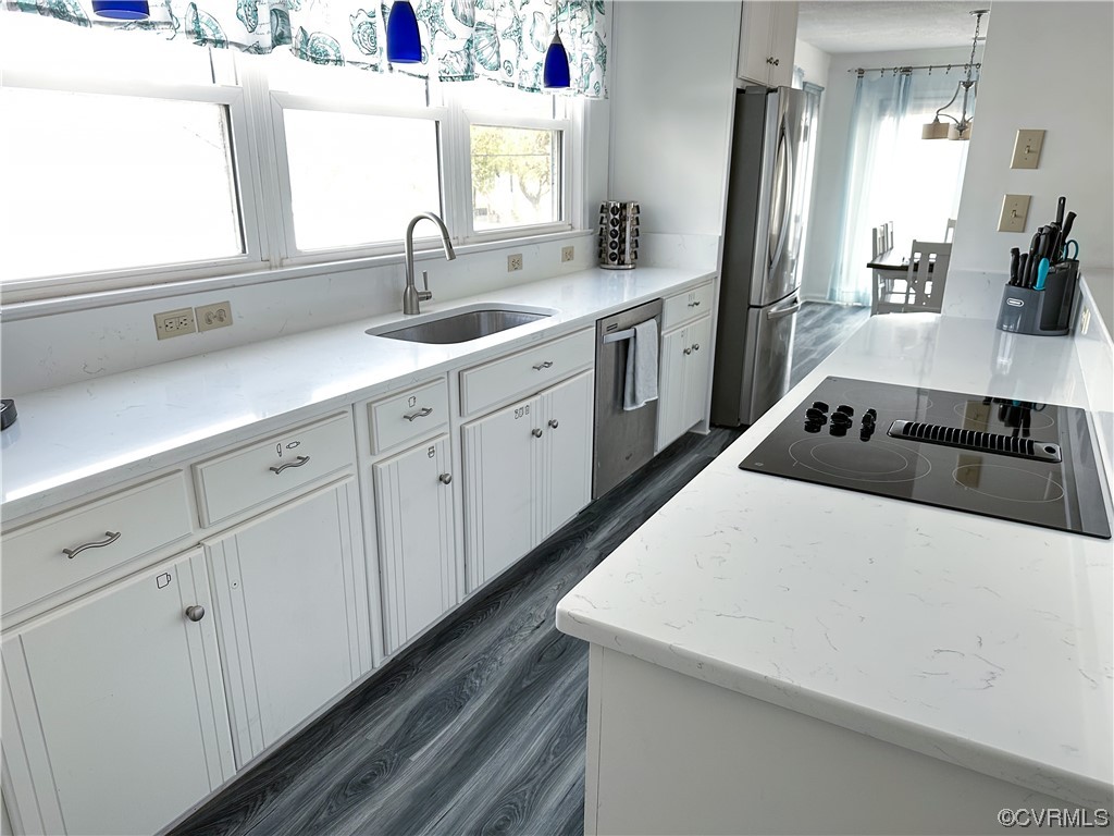 13 Lighthouse Drive Hampton, VA 23664 - Photo 8 of 28 a kitchen with a sink and white cabinets