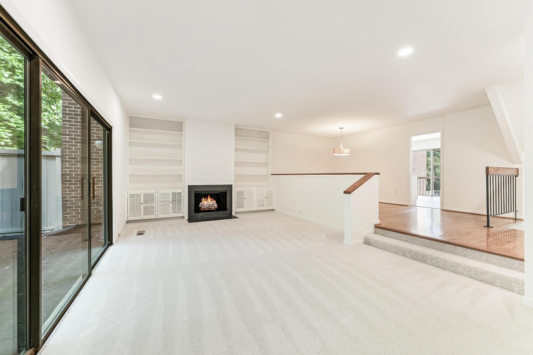 12023 Insha Court Reston, VA 20191 - Photo 30 of 52 a view of an empty room with a fireplace and a window
