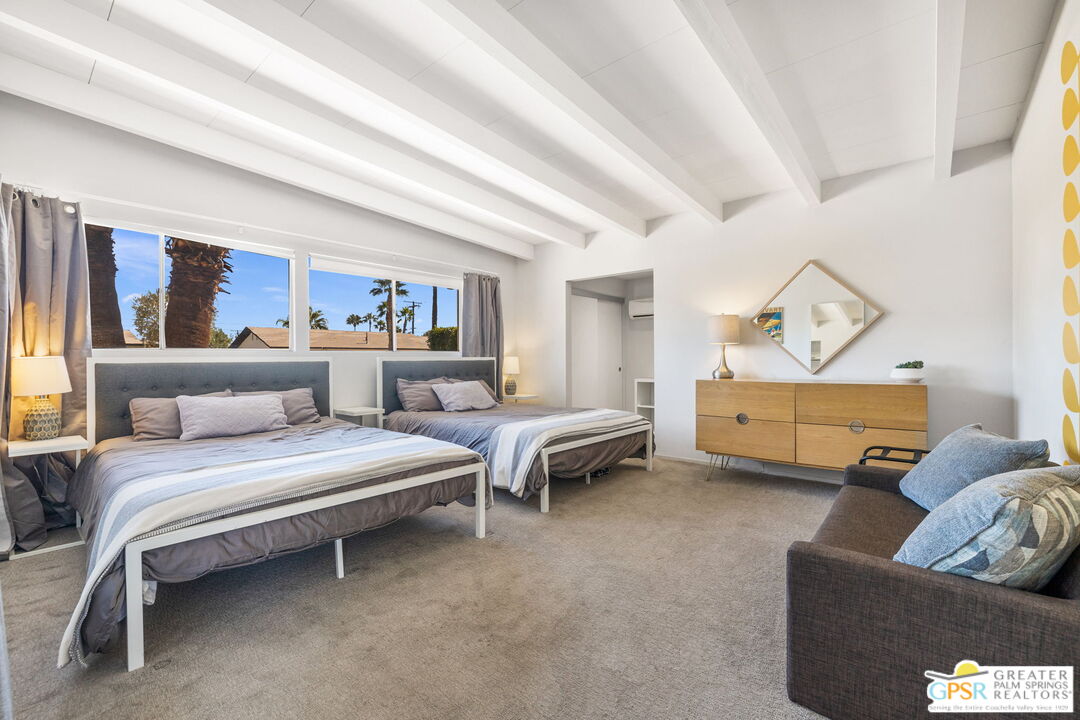 2267 North San Antonio Road Palm Springs, CA 92262 - Photo 12 of 40 a living room with furniture a rug and a window
