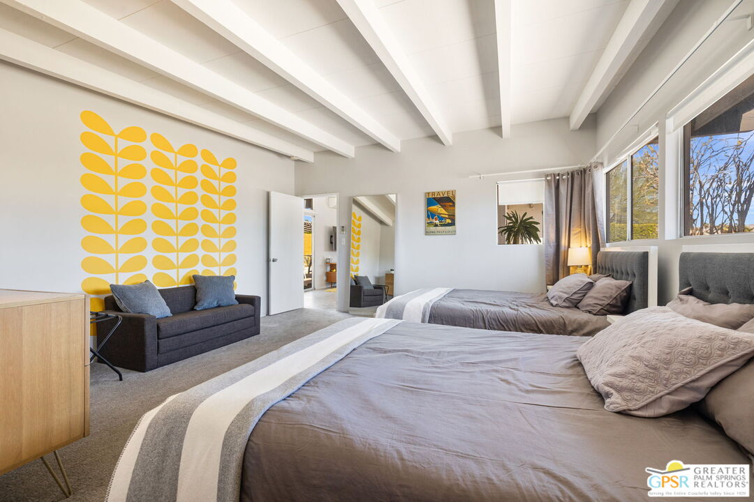 2267 North San Antonio Road Palm Springs, CA 92262 - Photo 13 of 40 a bedroom with a bed and a couch