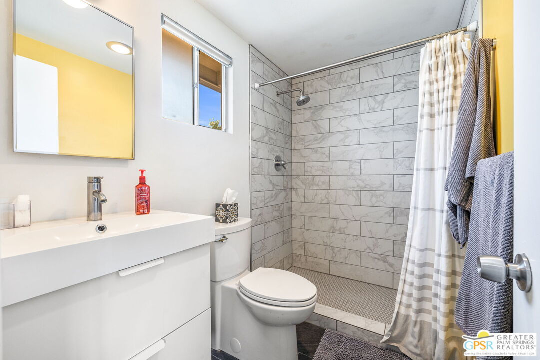 2267 North San Antonio Road Palm Springs, CA 92262 - Photo 14 of 40 a bathroom with a sink toilet and shower