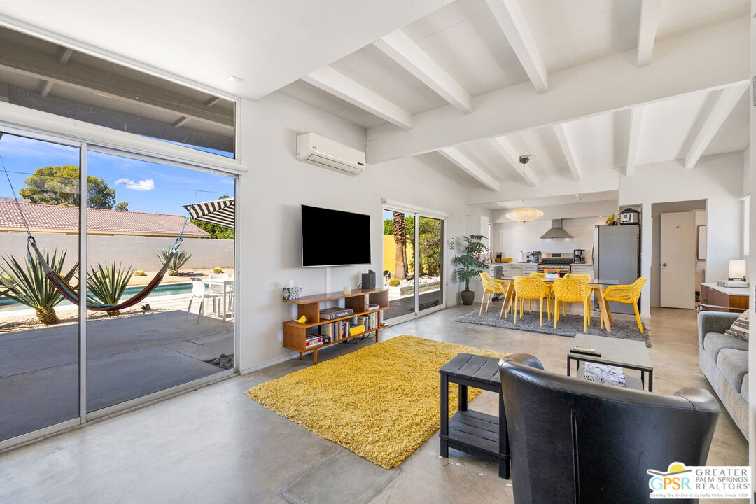2267 North San Antonio Road Palm Springs, CA 92262 - Photo 17 of 40 a living room with patio furniture and a flat screen tv