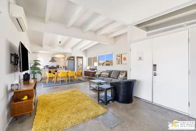 a room with furniture and a flat screen tv