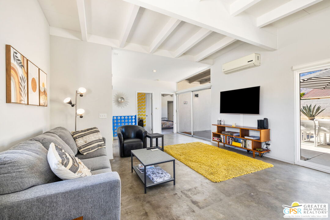 2267 North San Antonio Road Palm Springs, CA 92262 - Photo 20 of 40 a living room with furniture and a flat screen tv