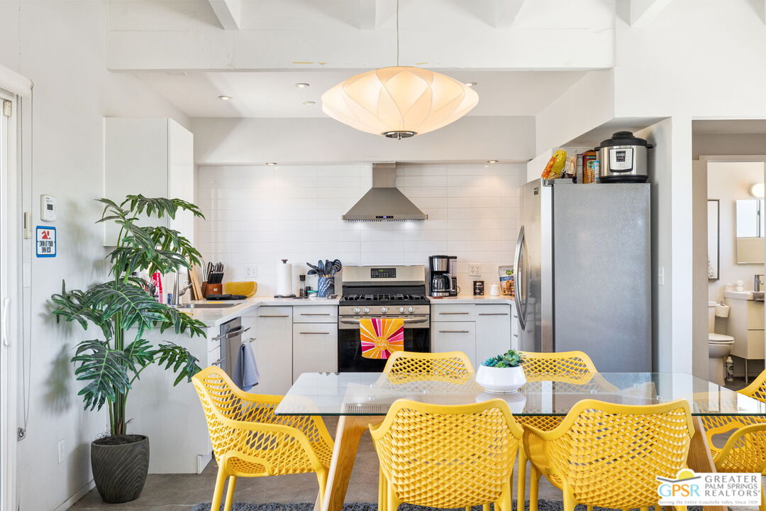 2267 North San Antonio Road Palm Springs, CA 92262 - Photo 2 of 40 a living room with furniture and a potted plant