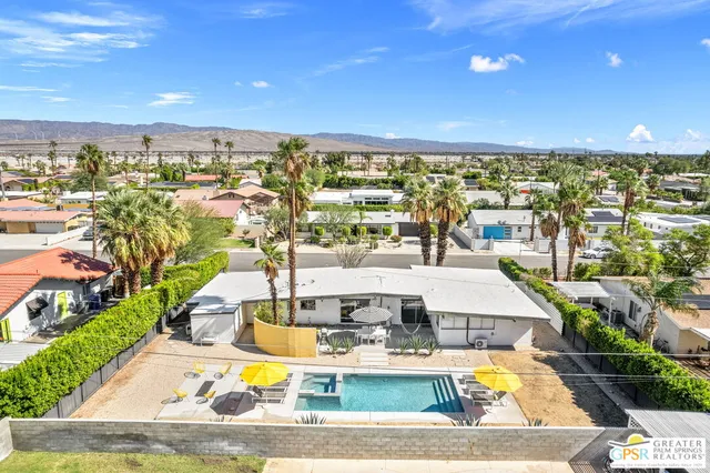 a view of a swimming pool and an outdoor space