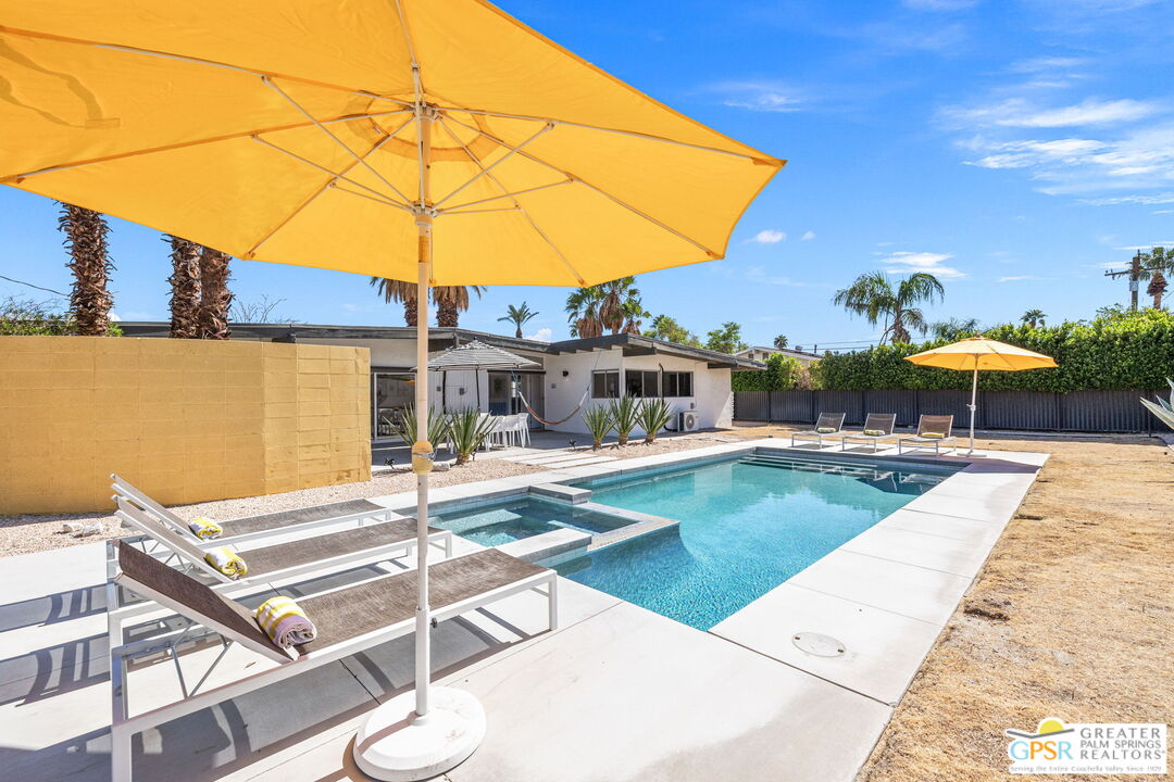 2267 North San Antonio Road Palm Springs, CA 92262 - Photo 31 of 40 a swimming pool with outdoor seating and yard