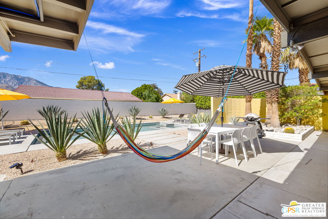 2267 North San Antonio Road Palm Springs, CA 92262 - Photo 38 of 40 a view of a chairs and table in the patio