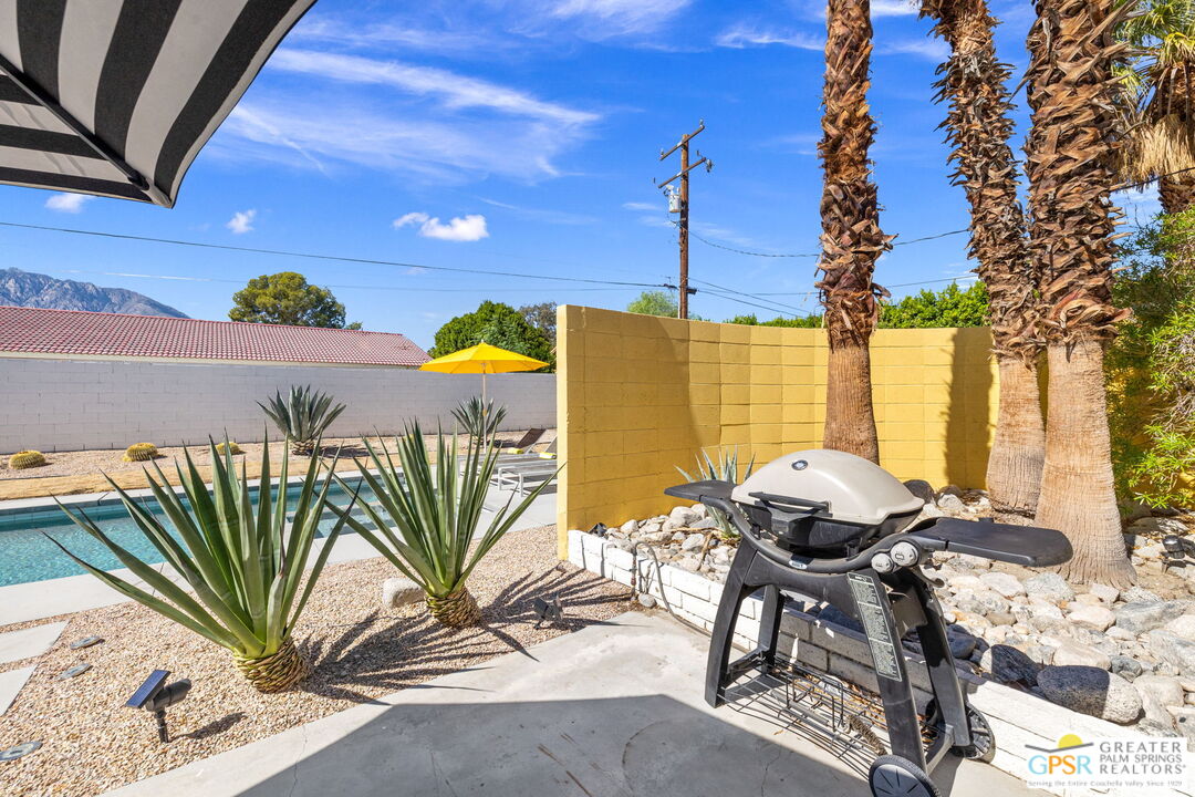 2267 North San Antonio Road Palm Springs, CA 92262 - Photo 39 of 40 a view of a chairs and table in patio