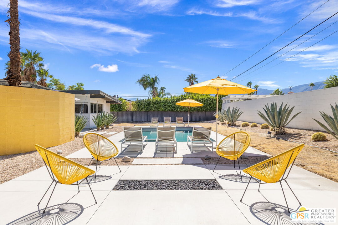 2267 North San Antonio Road Palm Springs, CA 92262 - Photo 6 of 40 a view of a swimming pool with a lounge chair