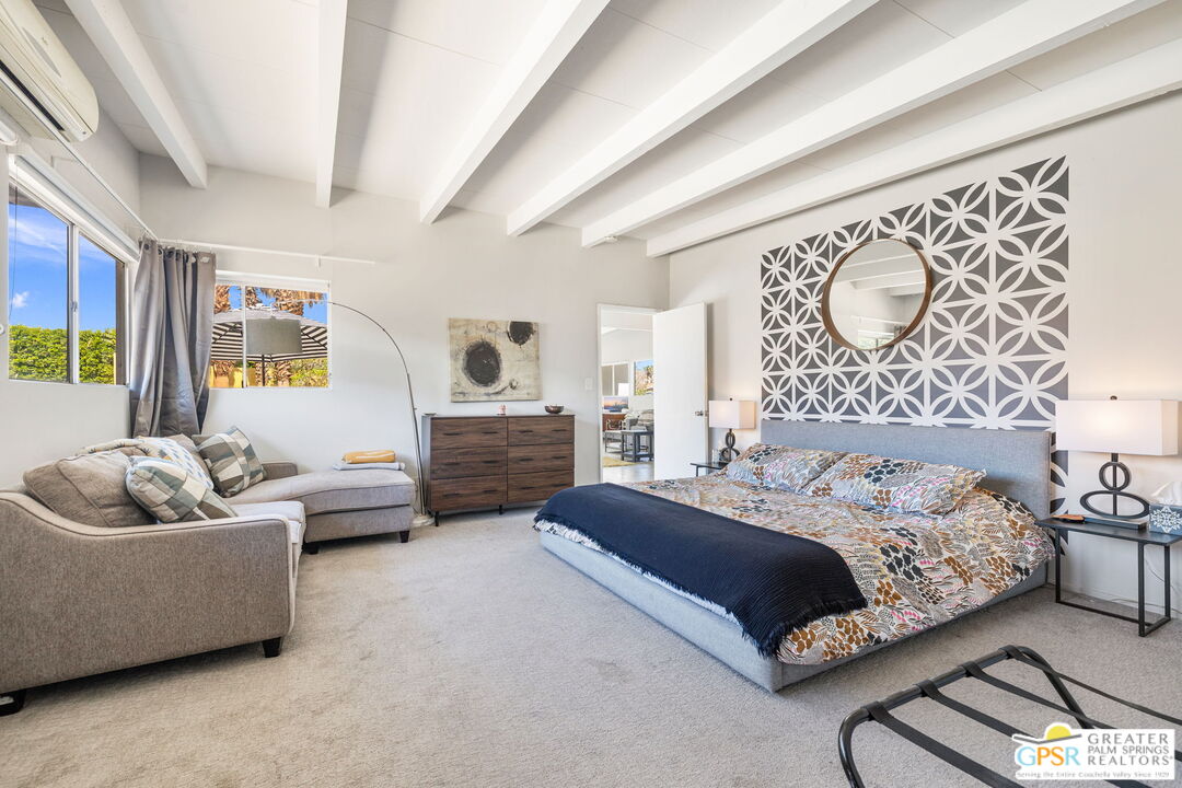 2267 North San Antonio Road Palm Springs, CA 92262 - Photo 8 of 40 a bedroom with a bed and couch