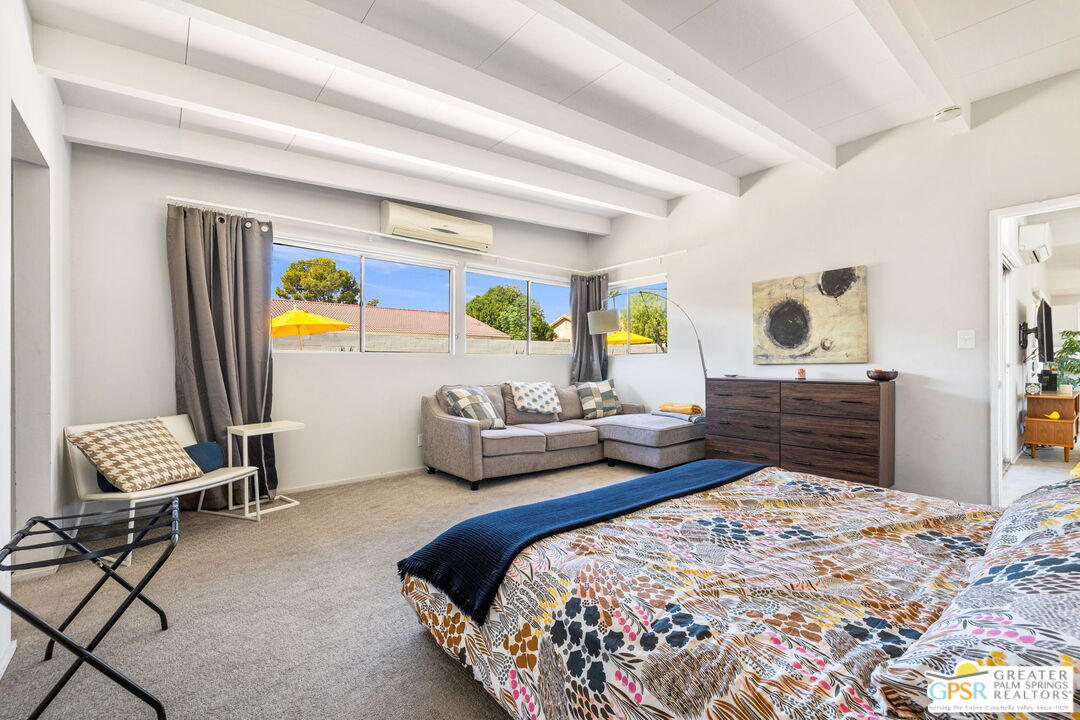 2267 North San Antonio Road Palm Springs, CA 92262 - Photo 9 of 40 a bedroom with a bed and wooden floor