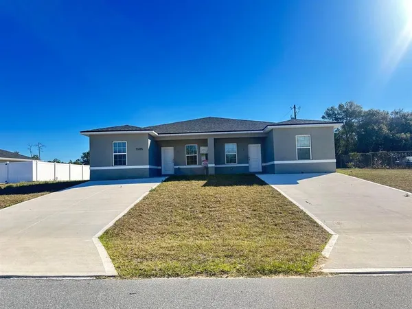 a view of house with yard
