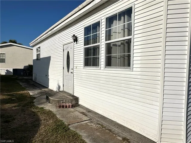 a view of a house with a large window