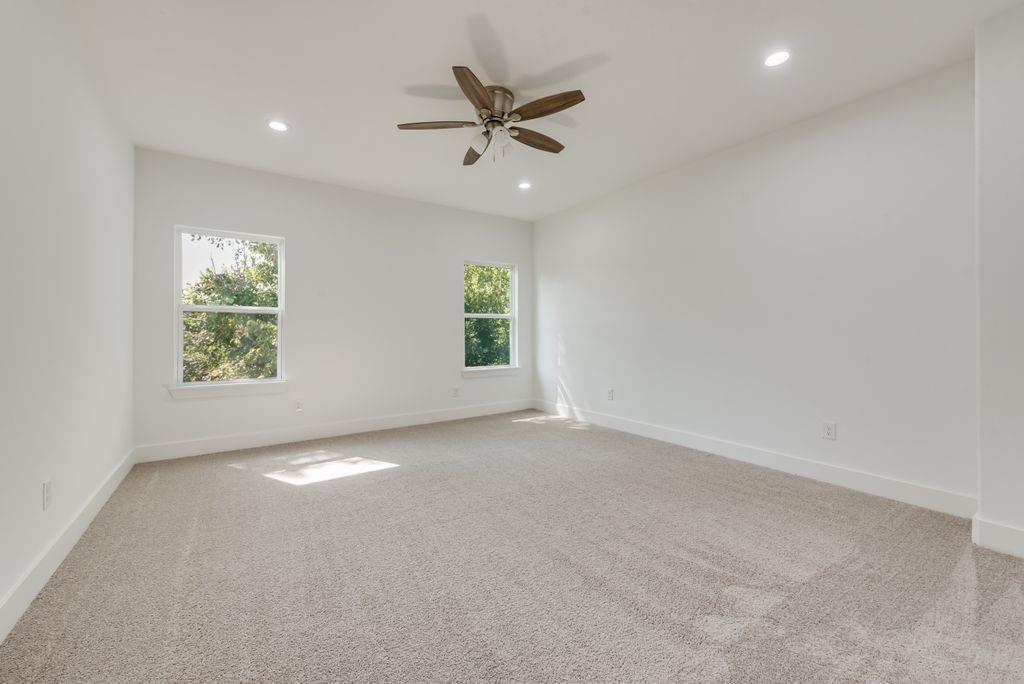 2346 Scott Street Dallas, TX 75215 - Photo 14 of 20 an empty room with windows and fan