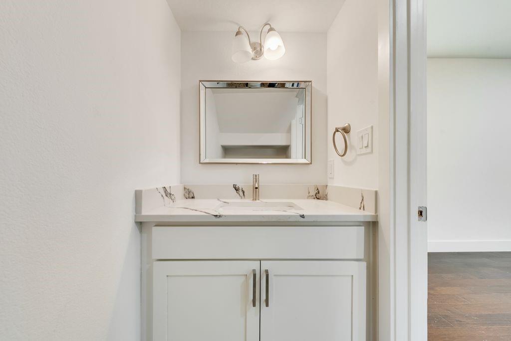 2346 Scott Street Dallas, TX 75215 - Photo 18 of 20 a bathroom with a sink and a mirror