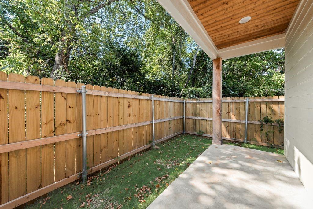 2346 Scott Street Dallas, TX 75215 - Photo 20 of 20 a view of a backyard with wooden fence