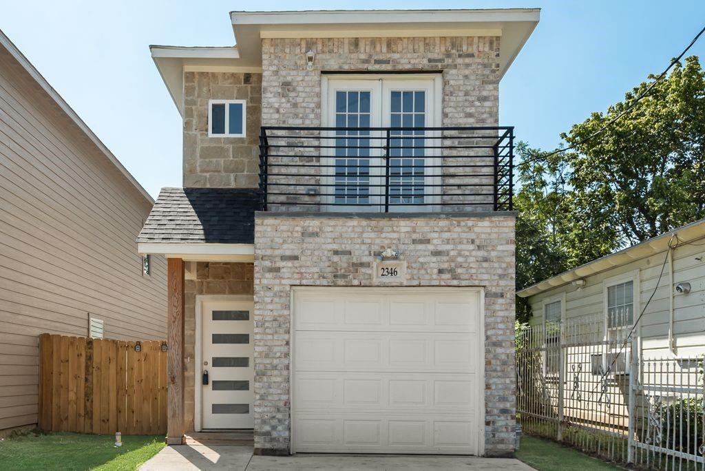 2346 Scott Street Dallas, TX 75215 - Photo 2 of 20 a front view of a house with a garden