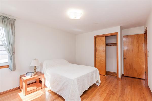237 Carver Street Springfield, MA 01108 - Photo 14 of 25 a bedroom with a bed and a window