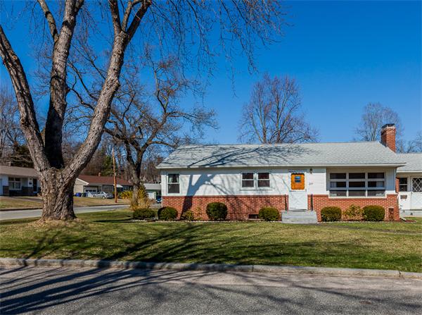 237 Carver Street Springfield, MA 01108 - Photo 2 of 25 a front view of a house with a garden