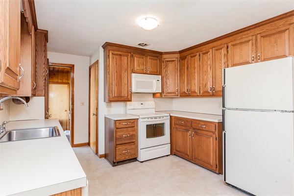 237 Carver Street Springfield, MA 01108 - Photo 8 of 25 a kitchen with stainless steel appliances a refrigerator sink and cabinets