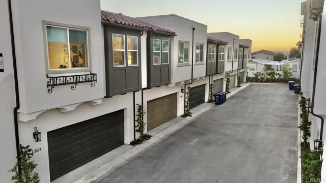 a view of a house with a balcony and door