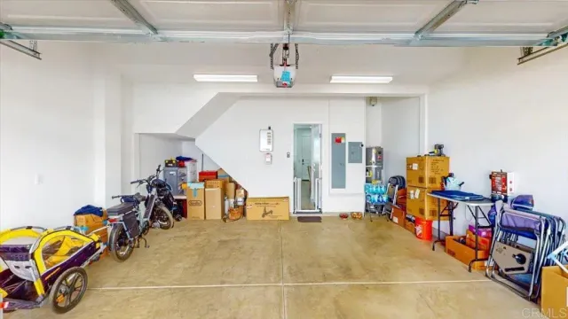 a living room with furniture a refrigerator and a dining table