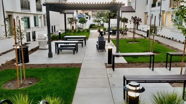 a swimming pool with outdoor seating yard and patio
