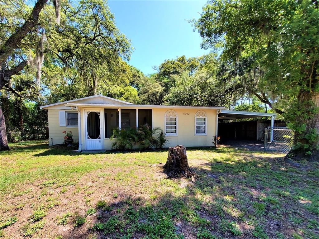 8002 Mays Avenue Riverview, FL 33578 - Photo 1 of 1 a front view of house with yard and trees in the background