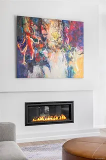 a view of fireplace with wooden floor