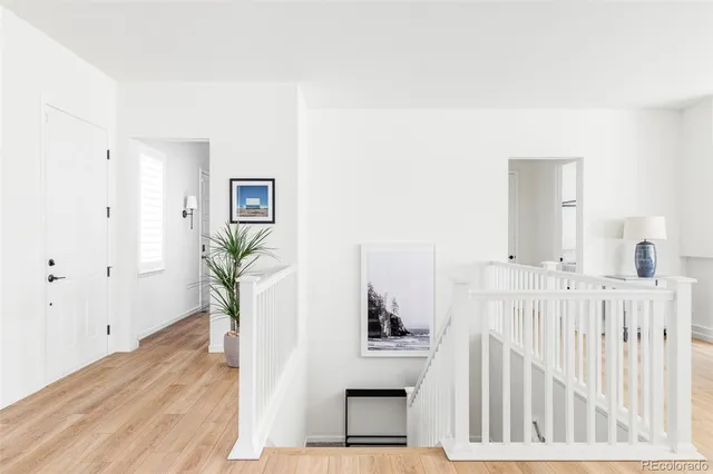 a view of entryway with wooden floor