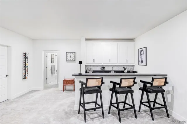 a kitchen with a table and chairs in it