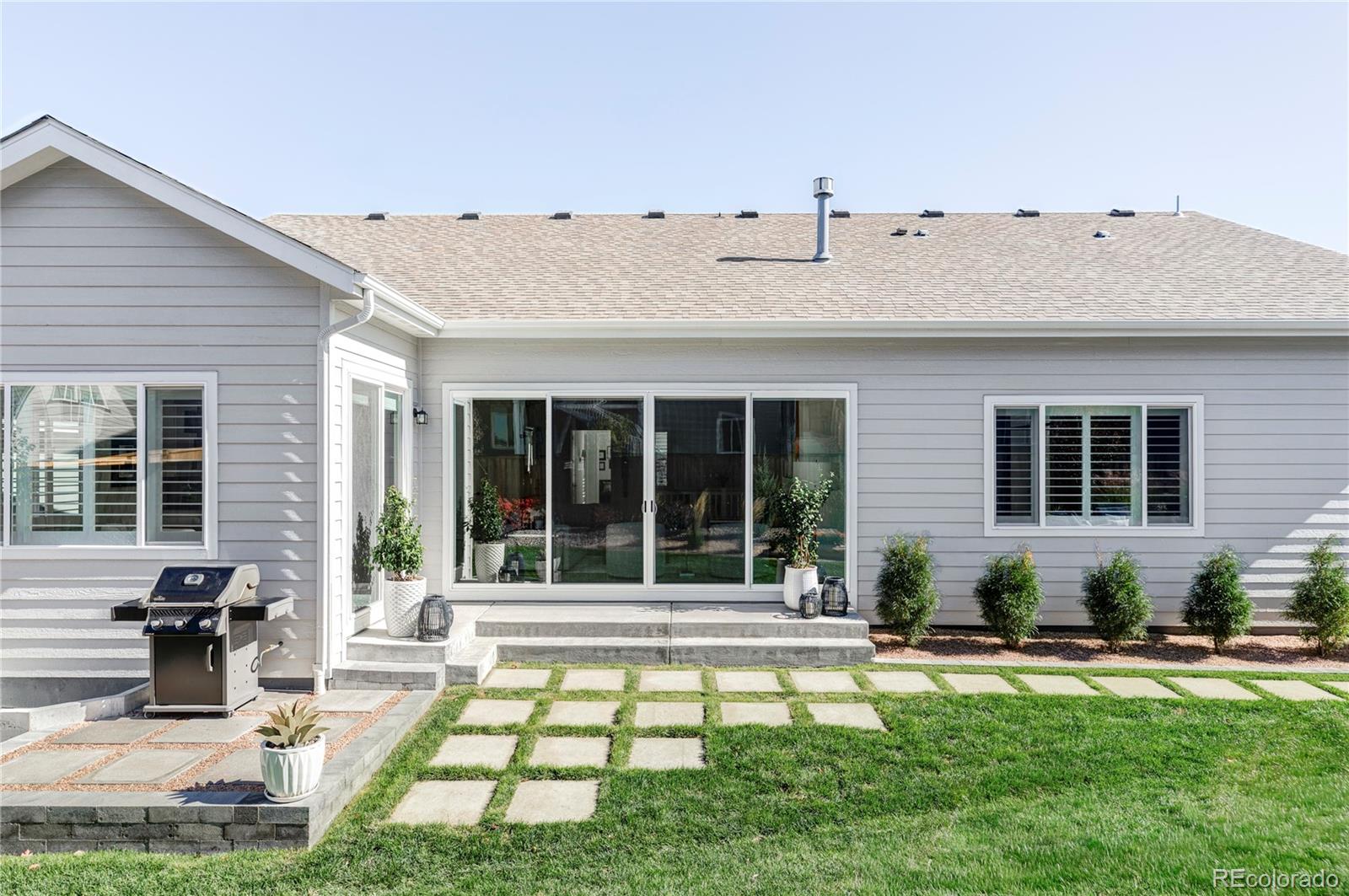 14395 Hop Clover Street Parker, CO 80134 - Photo 29 of 32 a view of a house with swimming pool and sitting area