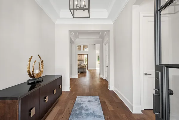 an empty room with wooden floor and closet