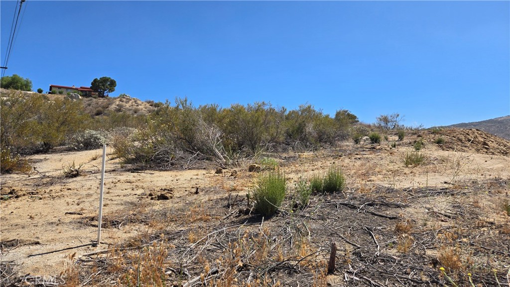 0 Leo Road Aguanga, CA 92536 - Photo 3 of 8 a view of a dry yard with mountains and a mountain