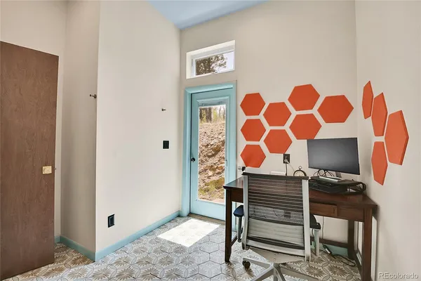 a bedroom with a bed and a chair