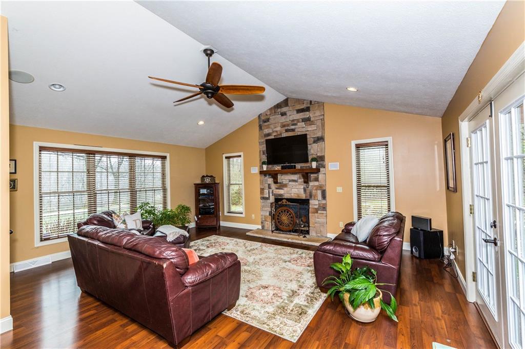 1440 Freeport Road Mars, PA 16046 - Photo 7 of 25 LOTS OF NATURAL LIGHT SHINE THROUGHOUT THIS HOME. BEAUTIFUL GAS STONE FIREPLACE, CATHEDRAL CEILING, AND FRENCH DOORS TO THE PATIO COVERED WITH A PERGOLA.