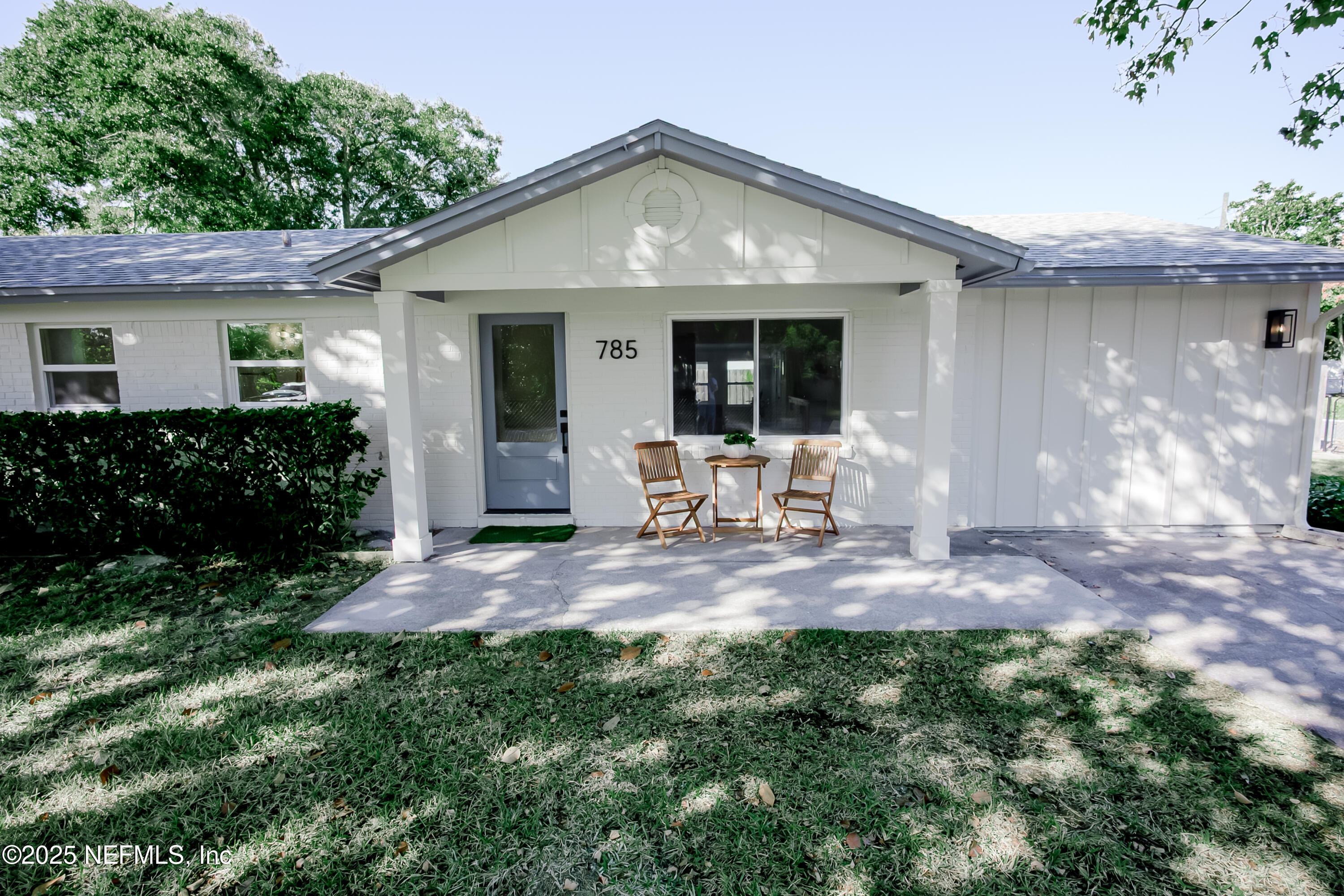 785 Triton Road Atlantic Beach, FL 32233 - Photo 1 of 46 a front view of a house with a yard and seating space