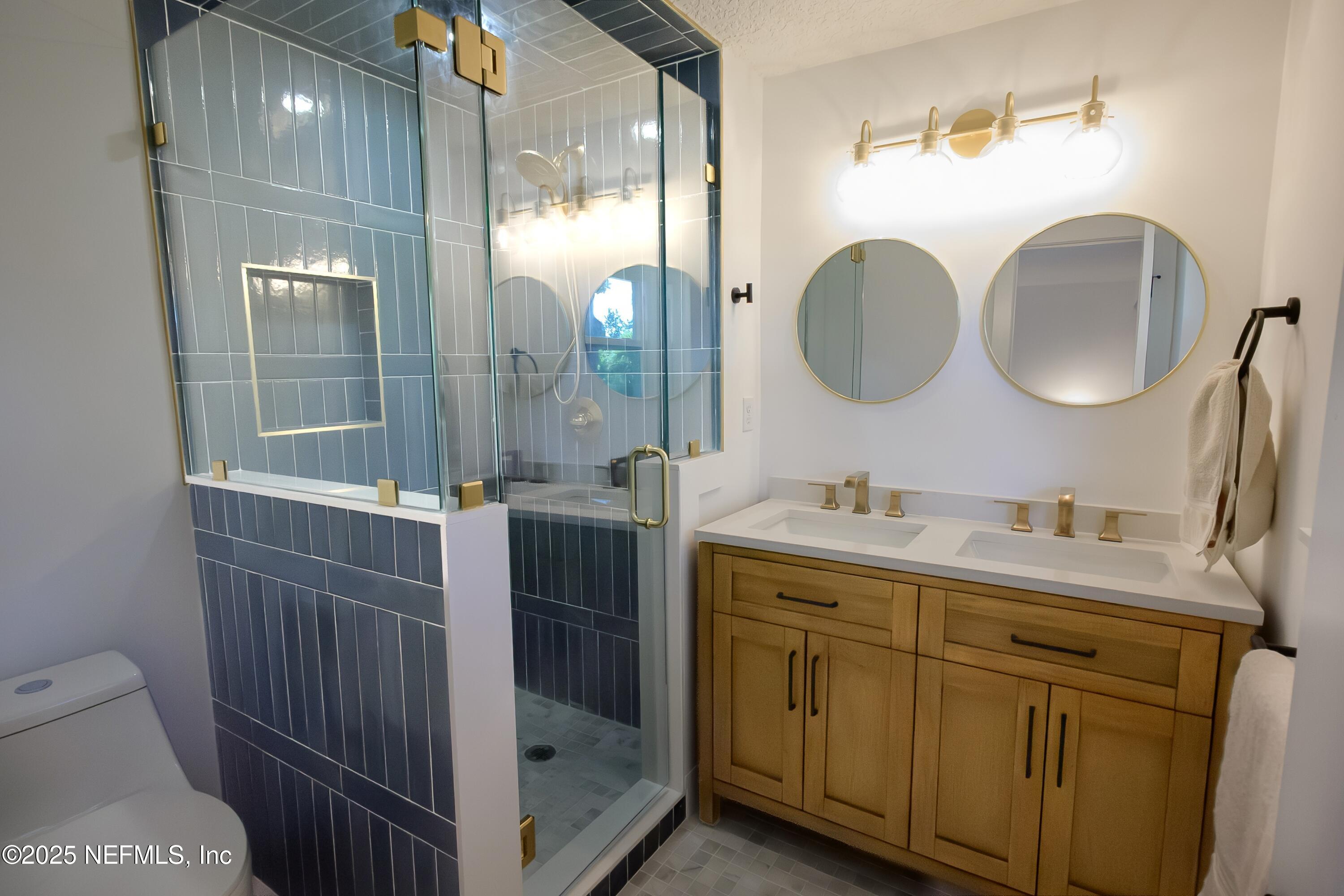 785 Triton Road Atlantic Beach, FL 32233 - Photo 18 of 46 a bathroom with a sink a toilet and shower